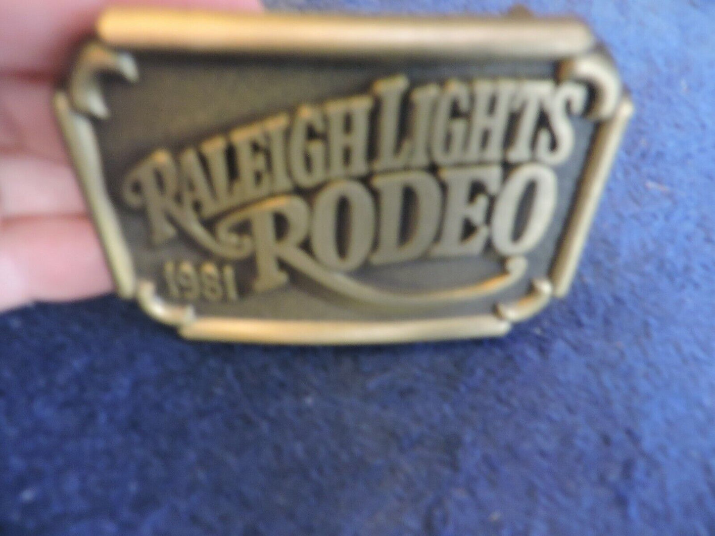 RALEIGH LIGHTS RODEO BELT BUCKLE 1981