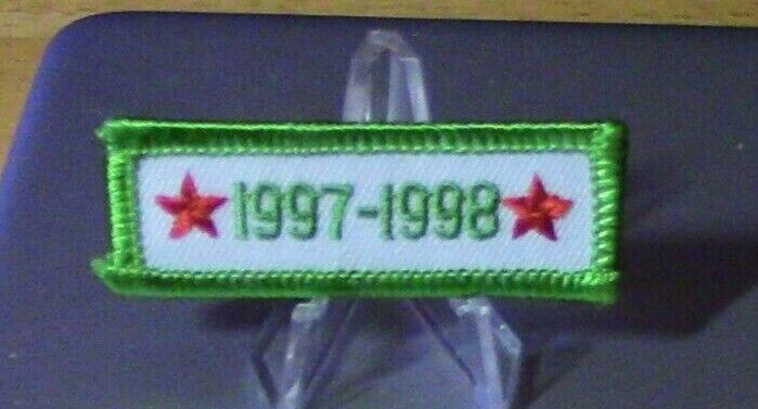 1997-1998 Segment Patch, Green Letters on White Background
