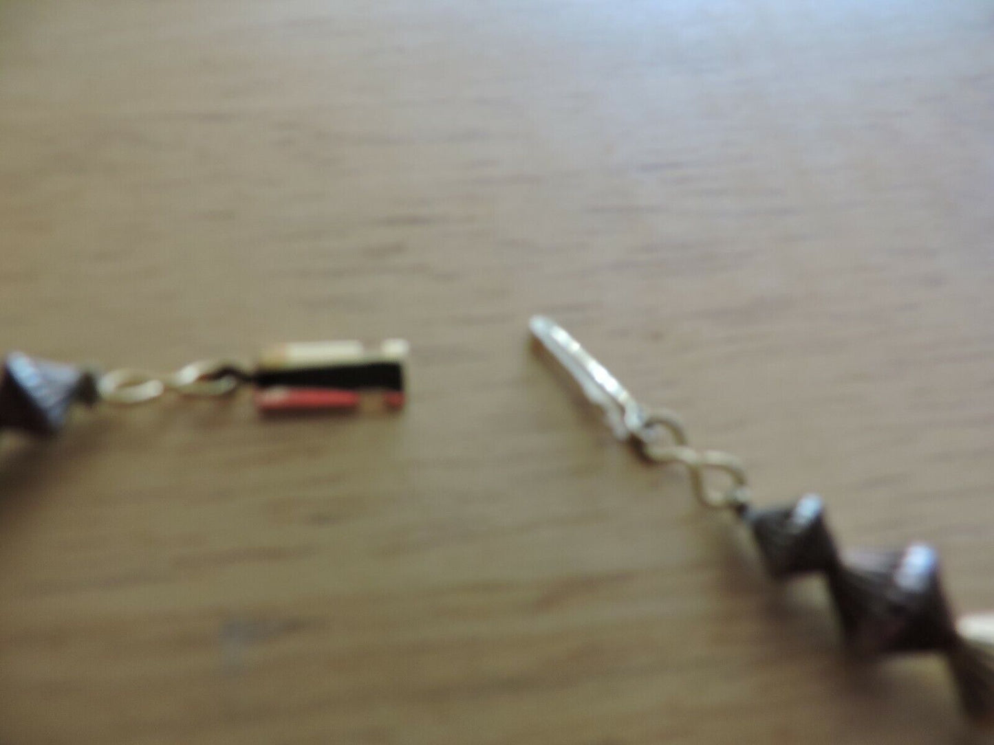 NECKLACE BLACK BEADS AND BROWN DISCS ( 21 INCHES FROM END TO END)