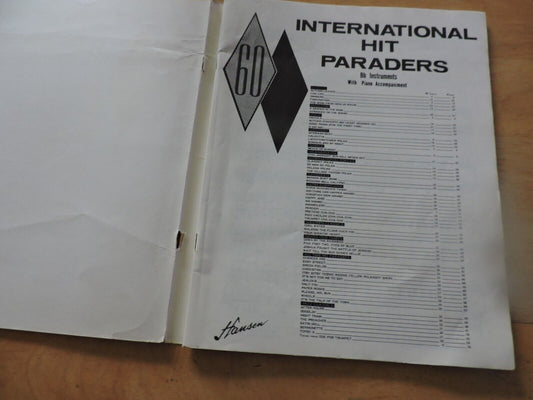 60 INTERNATIONAL HIT PARADERS Bb INSTRUMENTS WITH FULL PIANO ACCOMPANIMENT