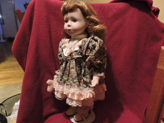 PORCELAIN DOLL WTH TEDDY BEAR