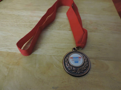 MEDAL MISSOURI WINTER GAMES 10 TH ANNUAL SPRINGFIELD MO 2 INCHES RED RIBBON