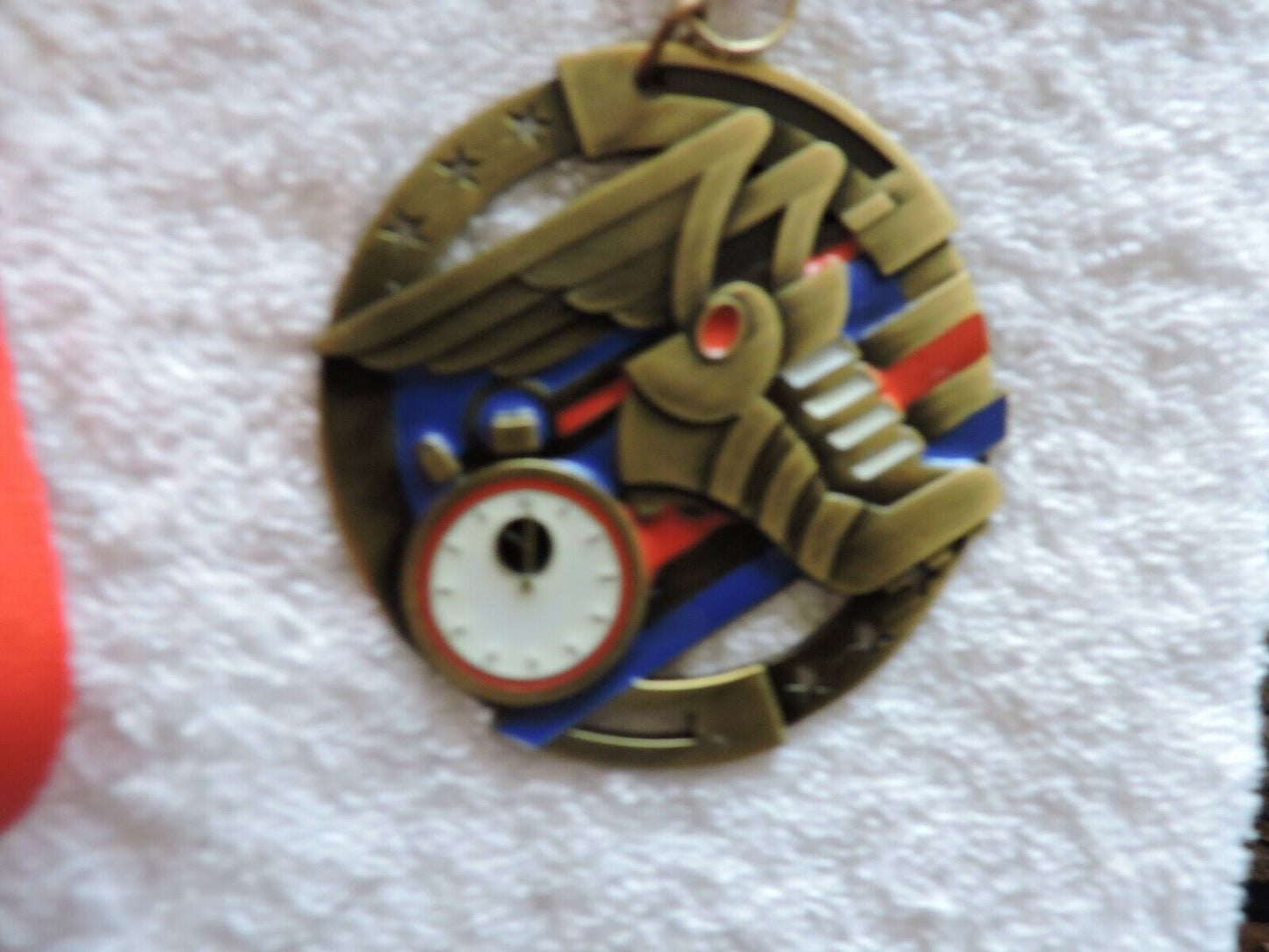 TRACK AND FIELD/RUNNING MEDAL 2.75 INCH ROUND WITH RED RIBBON