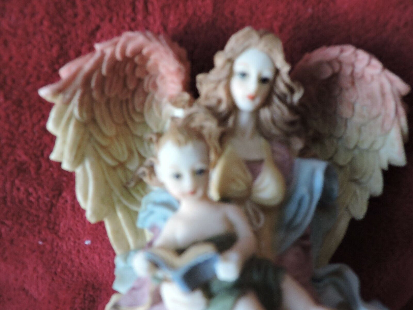 ANGEL HOLDING BABY PORCLAIN FIGURINE