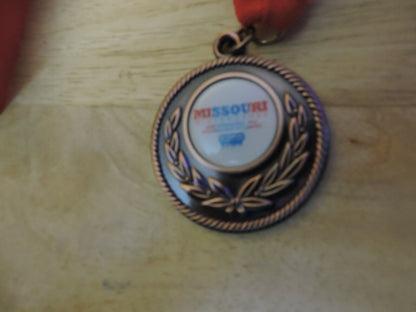 MEDAL MISSOURI WINTER GAMES 10 TH ANNUAL SPRINGFIELD MO 2 INCHES RED RIBBON