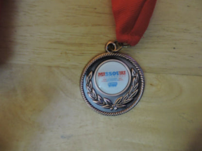 MEDAL MISSOURI WINTER GAMES 10 TH ANNUAL SPRINGFIELD MO 2 INCHES RED RIBBON