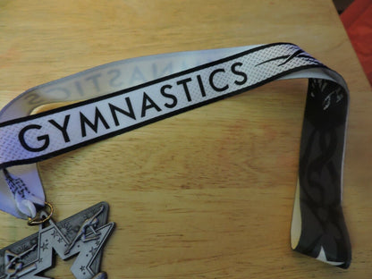 GYMNASTIC SILVER COLORED 2.5 X 2.5 INCH MEDAL WITH WHITE GYMNASTICS RIBBON