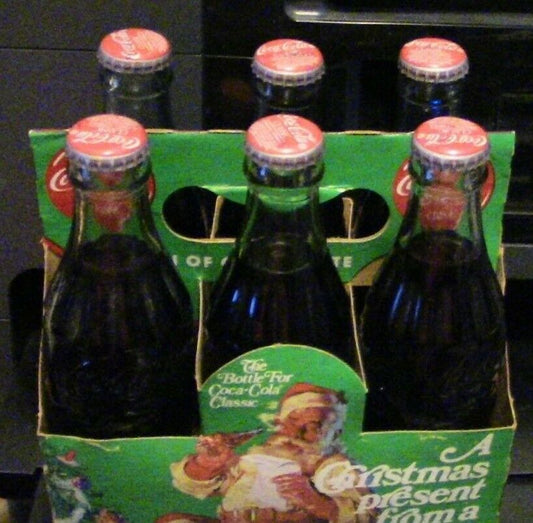 6 Pack of Coca Cola Bottles Celebrating Christmas