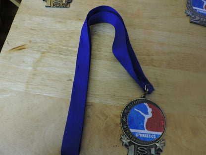 GYMNASTIC GOLD  COLORED 2.5 X 3.5 INCH MEDAL WITH BLUE RIBBON 1ST PLACE