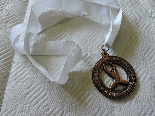 SANTA CLARA VALLEY  WRESTING ASSOCIATION CHAMPSHIP ROUND MEDAL ON WHITE RIBBON