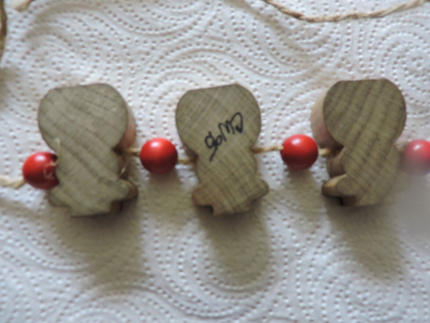 THREE WOODEN SNOWMEN ON ROPE DECORATION