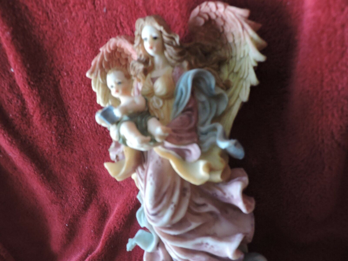 ANGEL HOLDING BABY PORCLAIN FIGURINE