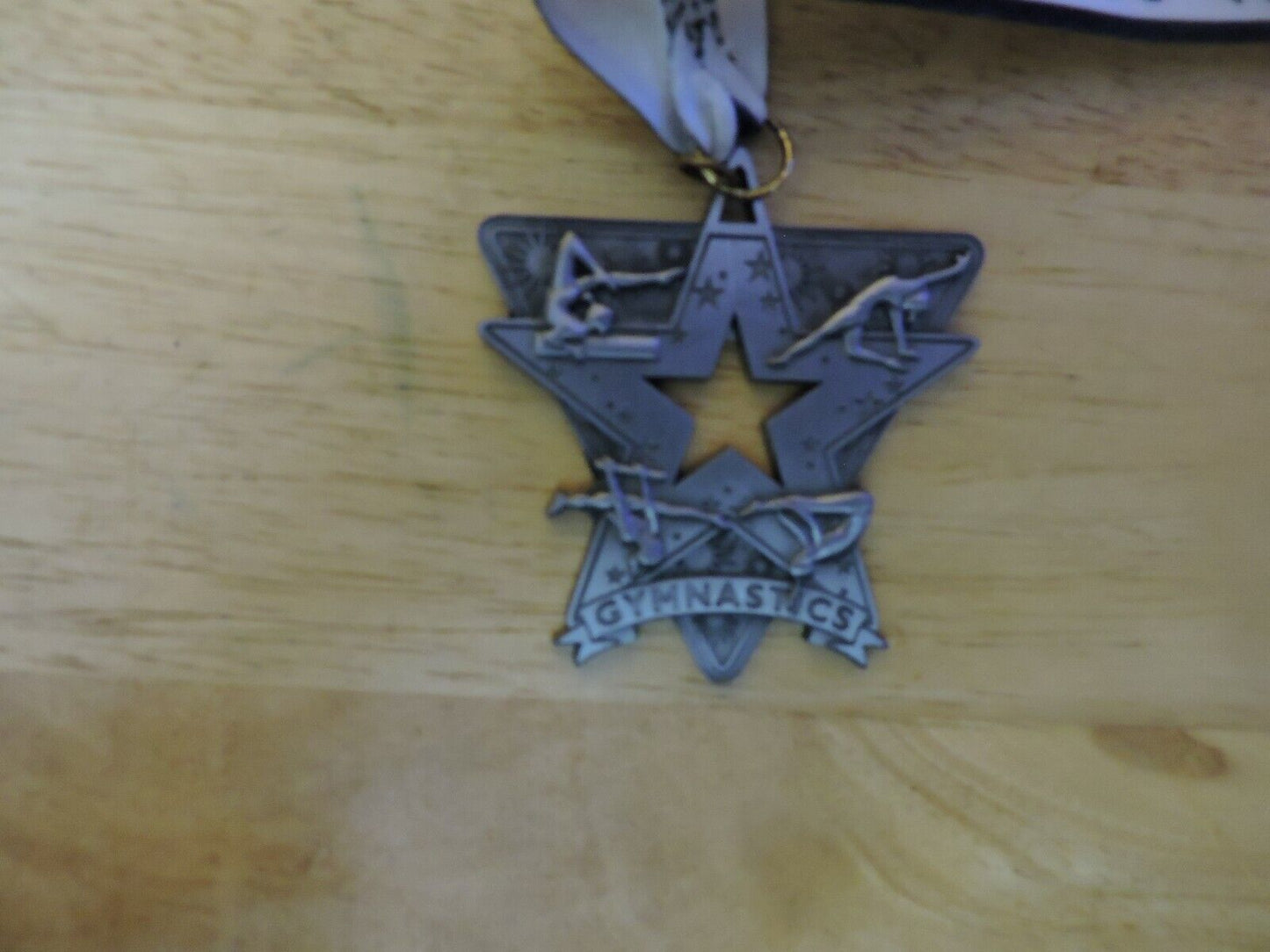 GYMNASTIC SILVER COLORED 2.5 X 2.5 INCH MEDAL WITH WHITE GYMNASTICS RIBBON