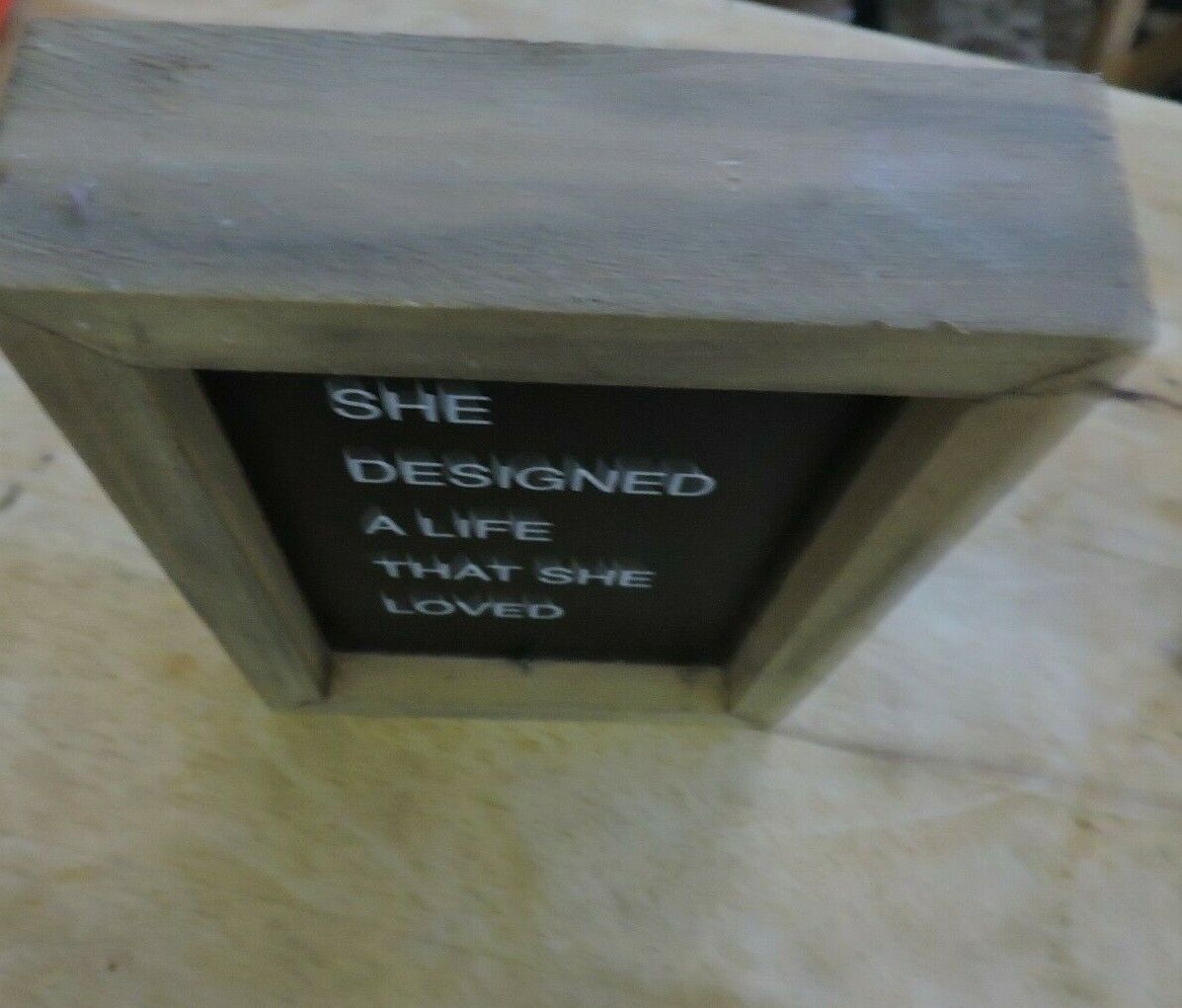 COLLINS BOX SIGN: "SHE DESIGNED A LIFE THAT SHE LOVED"  7X5 INCHES