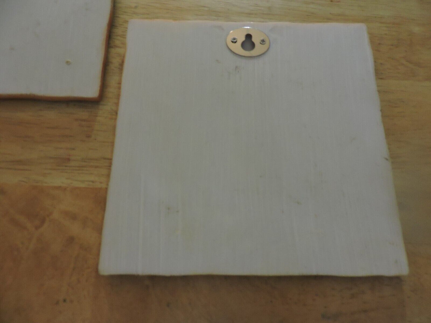 PAIR OF CERAMIC PLAQUES (WALL HANGINGS) 5.5X5.5 INCHES