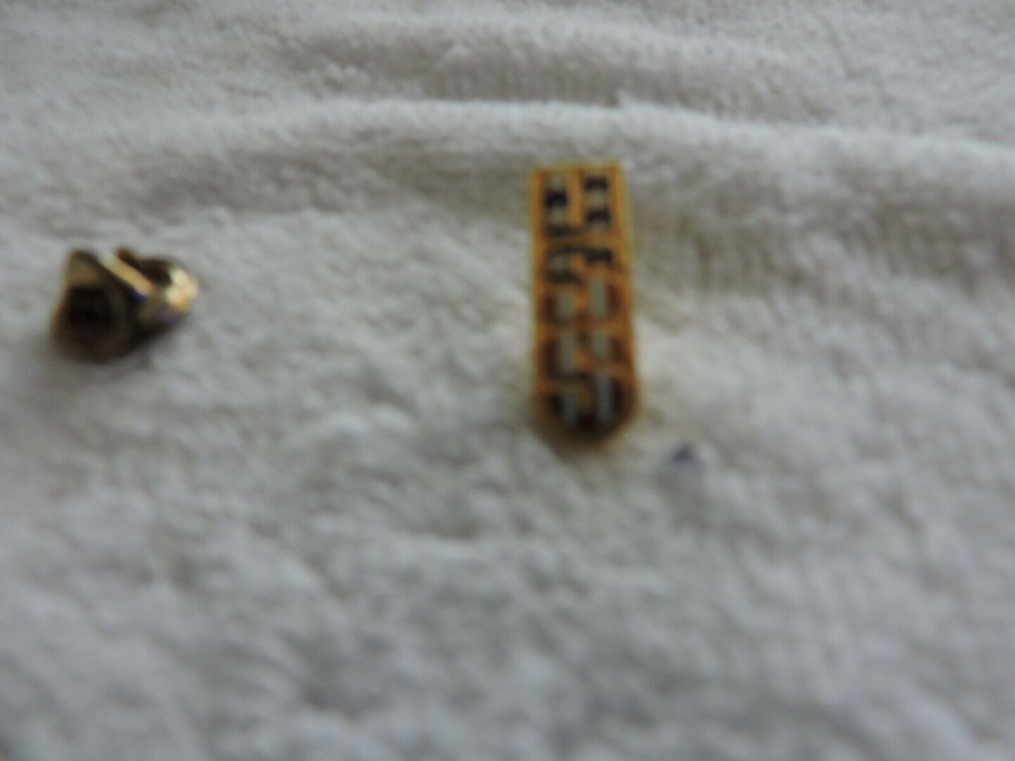 USS SWIMMING RED, WHITE AND BLUE PIN 1  X .25 INCHES