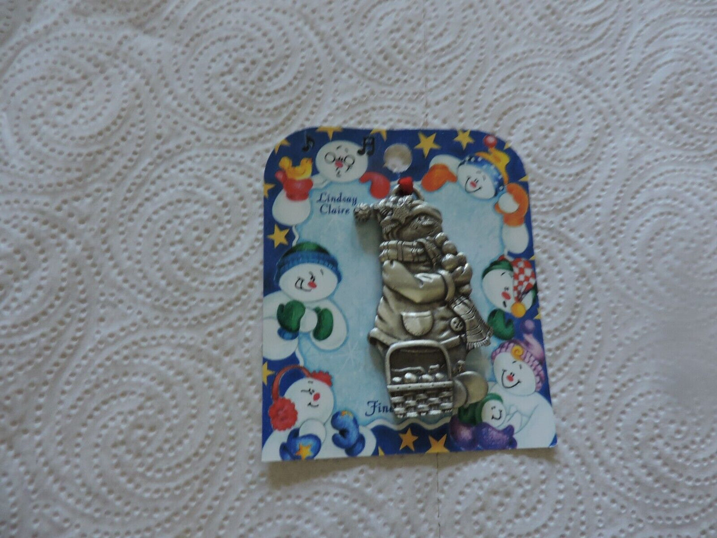 A LINDSAY CLAIRE DESIGN PEWTER SMOWWOMAN ORNAMENT