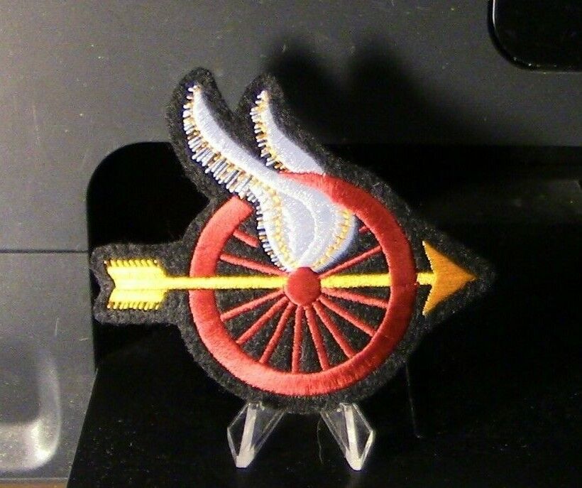 Motorcycle Memorabilia: Red Wheel/Yellow Arrow & White Wings Patch (Arrow Right)