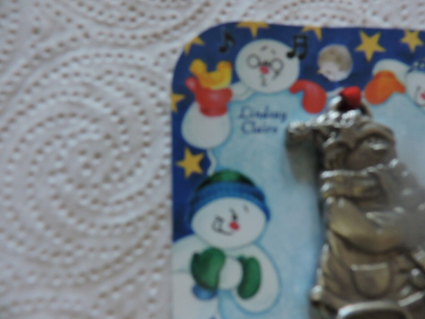 A LINDSAY CLAIRE DESIGN PEWTER SMOWWOMAN ORNAMENT