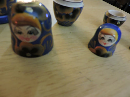 SET OF FIVE  WOODEN NESTING DOLLS (LARGEST 4 INCHES TALL)