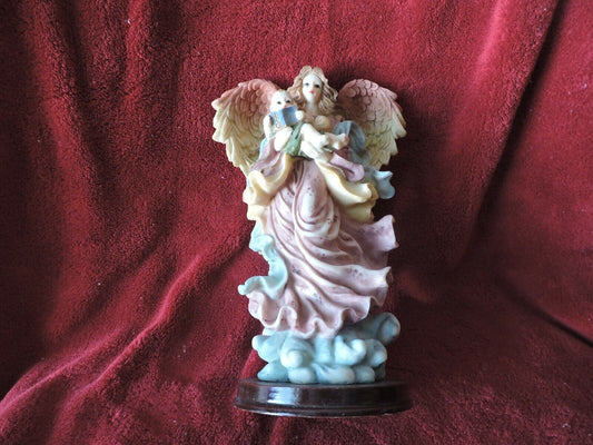 ANGEL HOLDING BABY PORCLAIN FIGURINE