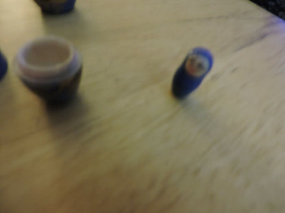 SET OF FIVE  WOODEN NESTING DOLLS (LARGEST 4 INCHES TALL)