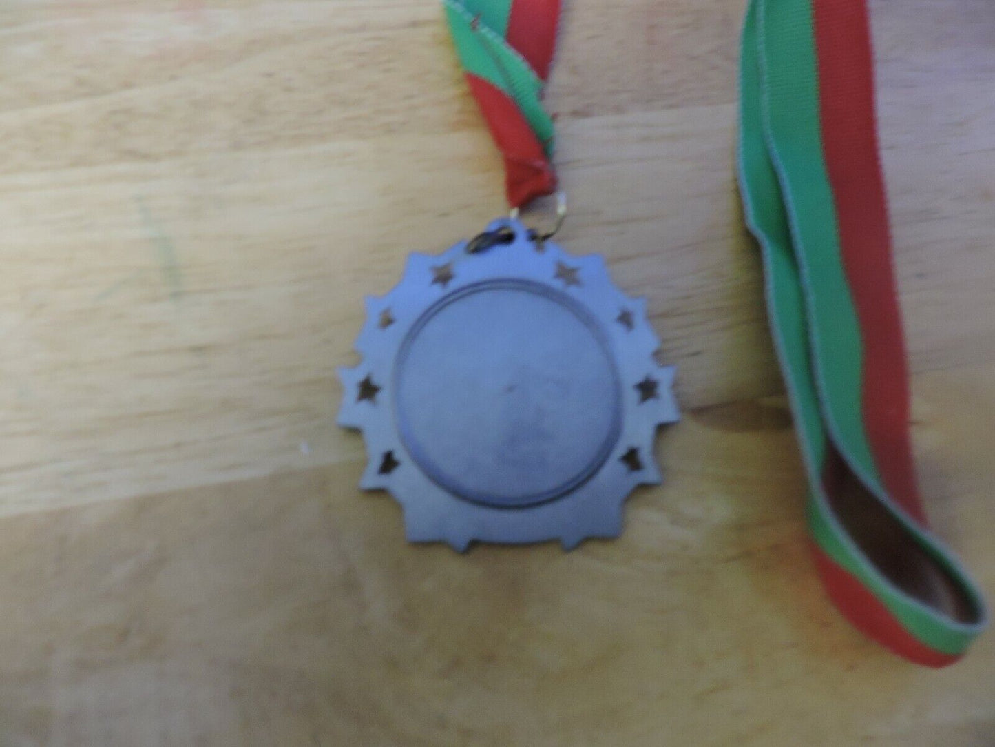 GYMNASTIC SILVER  COLORED 2.5 INCH ROUND MEDAL WITH RED AND GREEN RIBBON