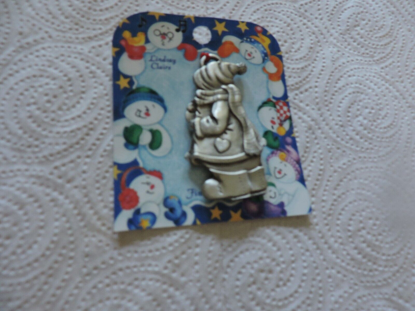 A LINDSAY CLAIRE DESIGN PEWTER SMOWWOMAN ORNAMENT
