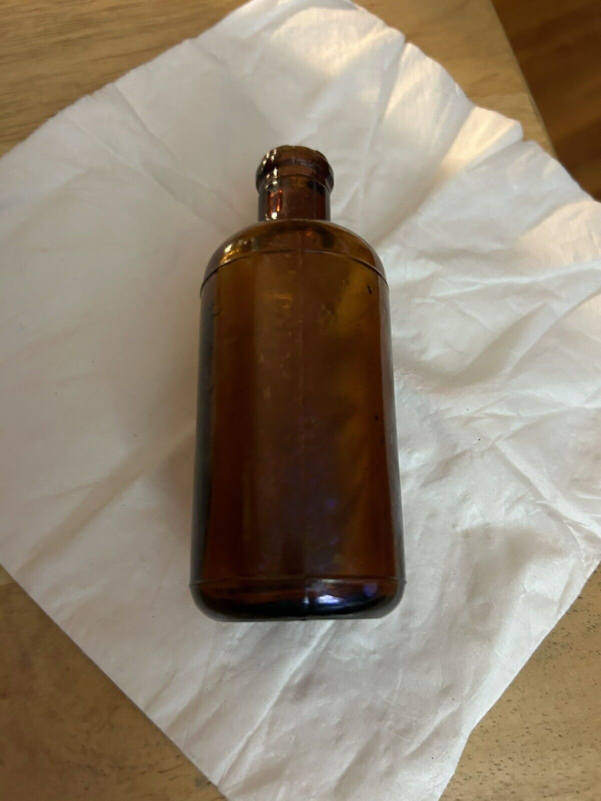 BROWN ROUND BOTTLE UNMARKED 4.5 X 1.75 INCHES EMPTY