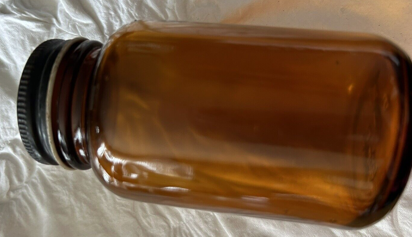 ROUND  BROWN BOTTLE--EMPTY--NO LABEL 3.75 X 2 INCHES