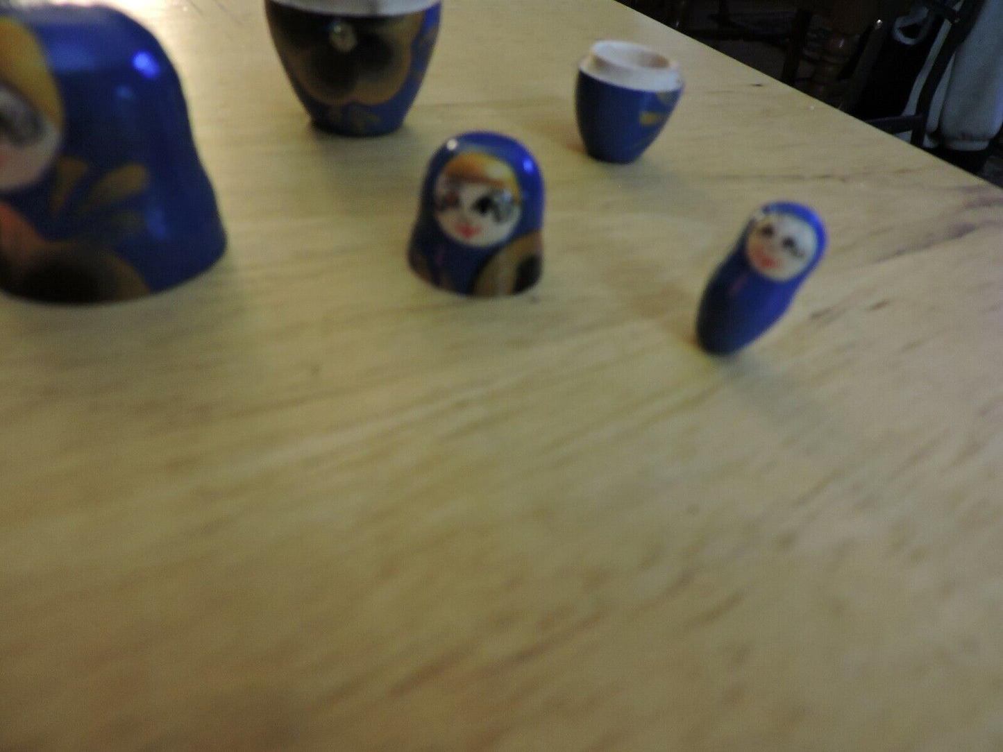 SET OF FIVE  WOODEN NESTING DOLLS (LARGEST 4 INCHES TALL)