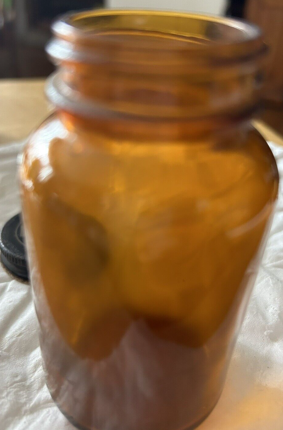 ROUND  BROWN BOTTLE--EMPTY--NO LABEL 3.75 X 2 INCHES