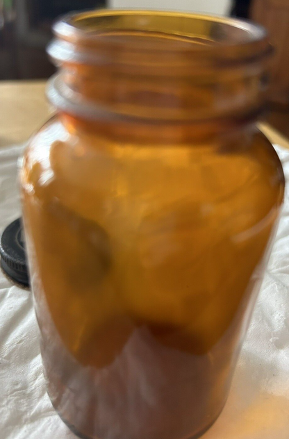 ROUND  BROWN BOTTLE--EMPTY--NO LABEL 3.75 X 2 INCHES