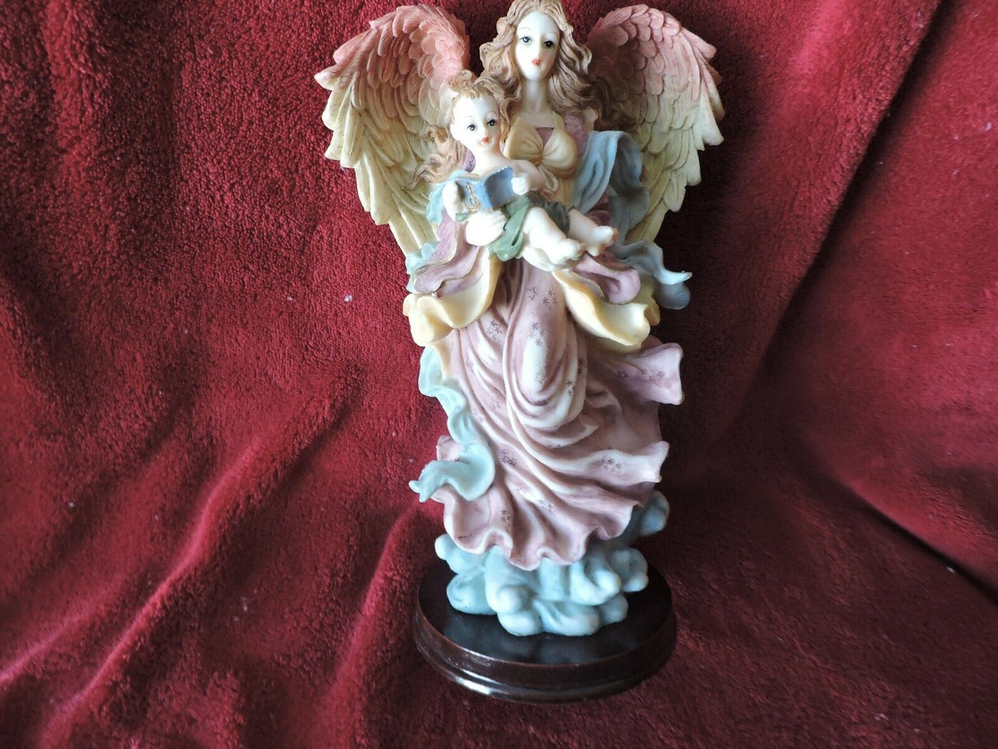 ANGEL HOLDING BABY PORCLAIN FIGURINE