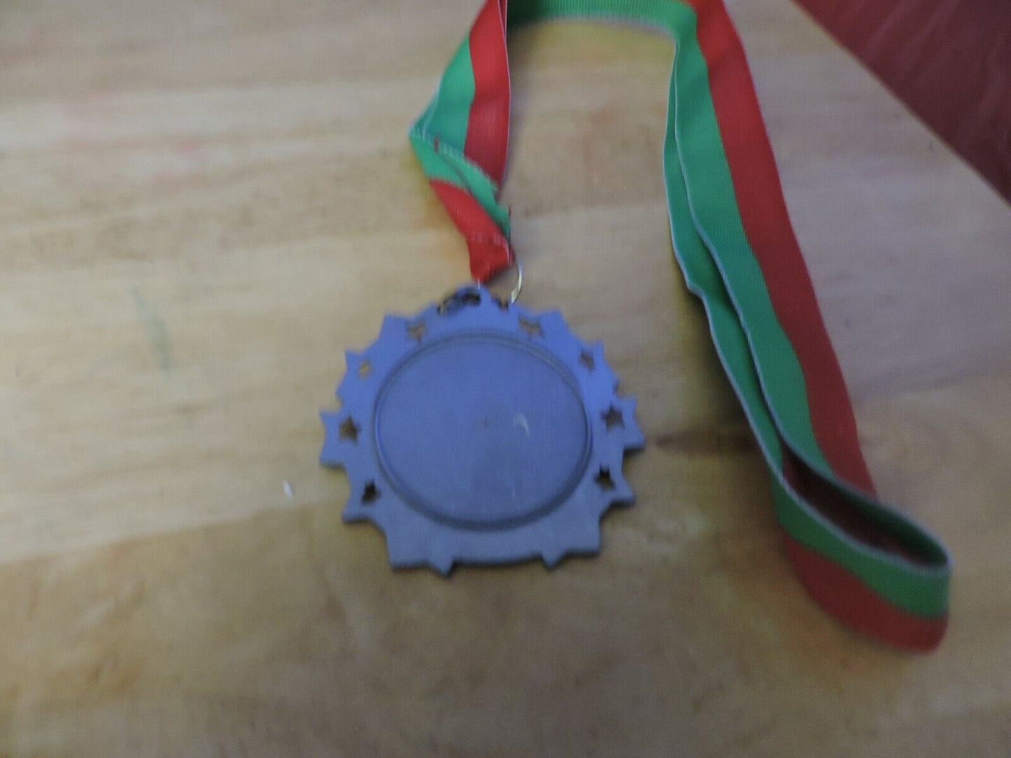 GYMNASTIC SILVER  COLORED 2.5 INCH ROUND MEDAL WITH RED AND GREEN RIBBON