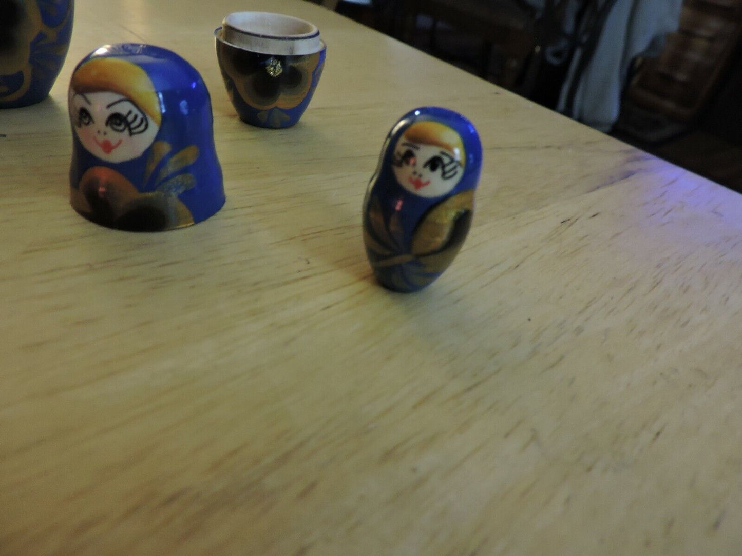 SET OF FIVE  WOODEN NESTING DOLLS (LARGEST 4 INCHES TALL)
