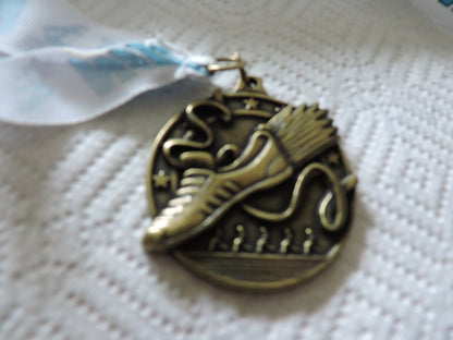 RUNNING MEDAL--2.25 X 2 INCHES WHITE RIBBON WITH BLUE LETTERING