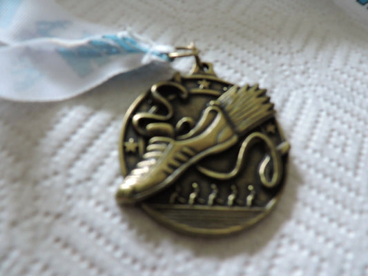 RUNNING MEDAL--2.25 X 2 INCHES WHITE RIBBON WITH BLUE LETTERING