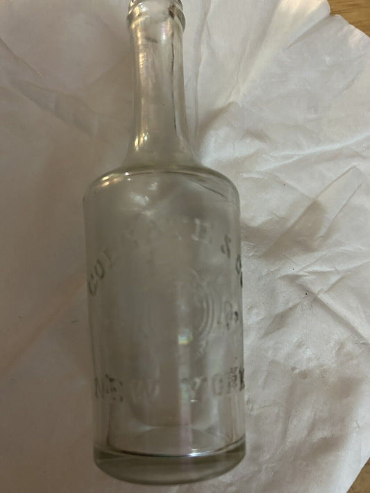 CLEAR  LONG NECK ROUND BOTTLE COLGATE & COMPANY NEW YORK, 5.5X1.5 INCHES