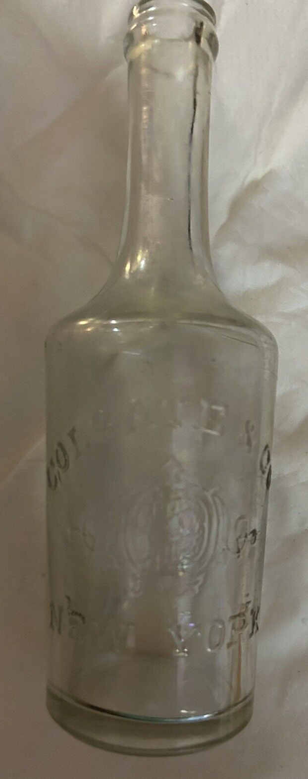 CLEAR  LONG NECK ROUND BOTTLE COLGATE & COMPANY NEW YORK, 5.5X1.5 INCHES