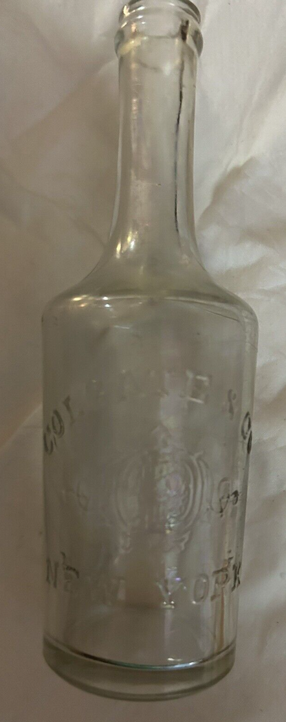 CLEAR  LONG NECK ROUND BOTTLE COLGATE & COMPANY NEW YORK, 5.5X1.5 INCHES