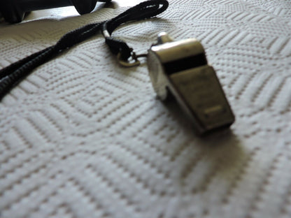 VINTAGE BRASS WHISTLE (WINDSOR CLARION) WITH BLACK LANYARD