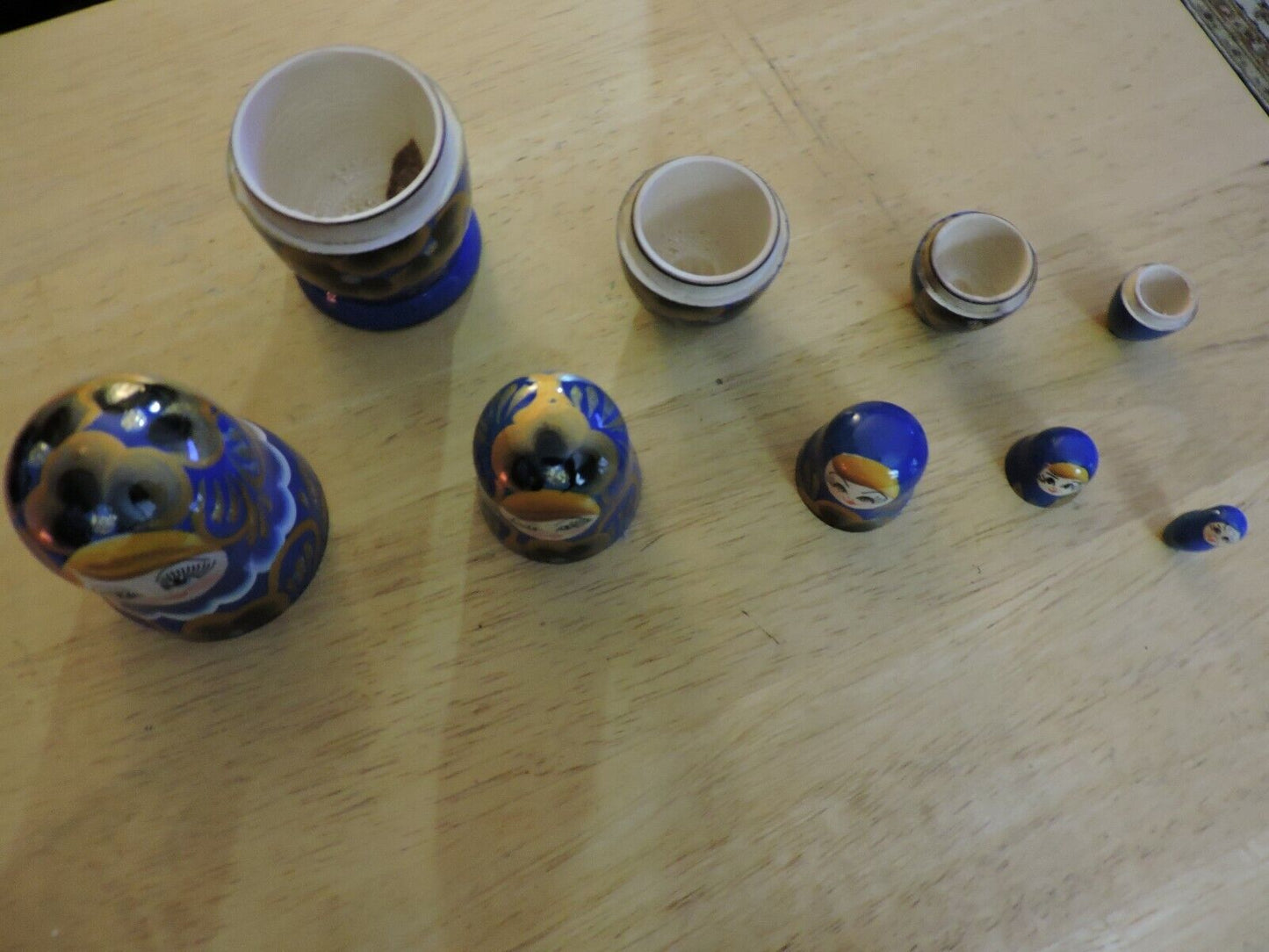 SET OF FIVE  WOODEN NESTING DOLLS (LARGEST 4 INCHES TALL)