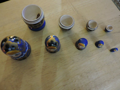 SET OF FIVE  WOODEN NESTING DOLLS (LARGEST 4 INCHES TALL)