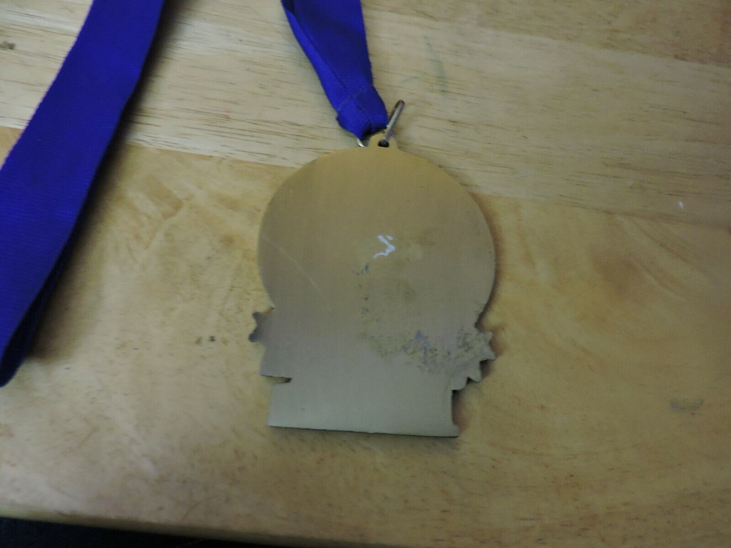 GYMNASTIC GOLD  COLORED 2.5 X 3.5 INCH MEDAL WITH BLUE RIBBON 1ST PLACE