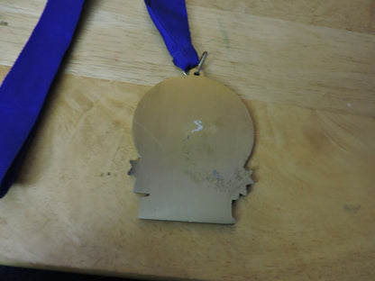 GYMNASTIC GOLD  COLORED 2.5 X 3.5 INCH MEDAL WITH BLUE RIBBON 1ST PLACE