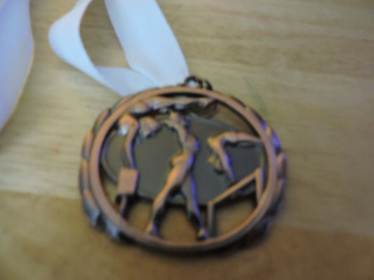 GYMNASTIC BRONZE COLORED 2.5 INCH MEDAL WITH WHITE RIBBON