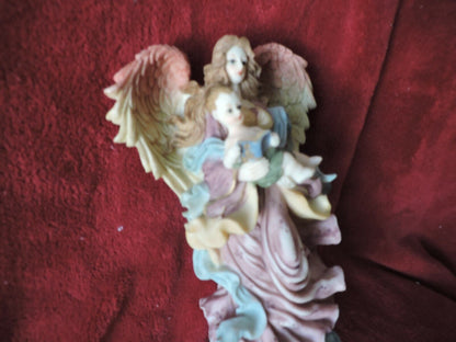 ANGEL HOLDING BABY PORCLAIN FIGURINE