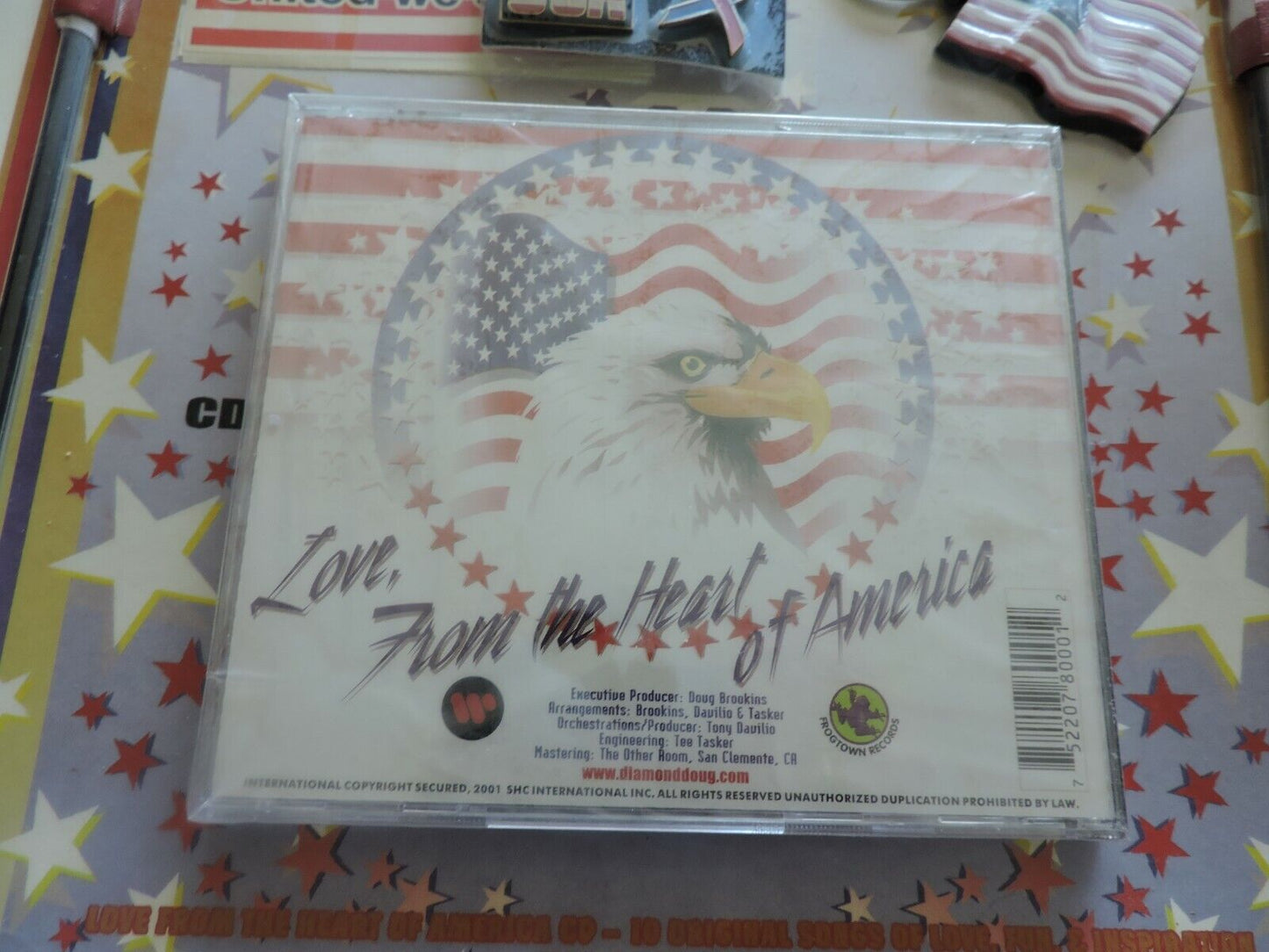 PATRIOT PACKAGE: 2 STICK FLAGS, BELT BUCKLE, MAGNET, 3 FLAG DECALS, 3 LAPEL PINS