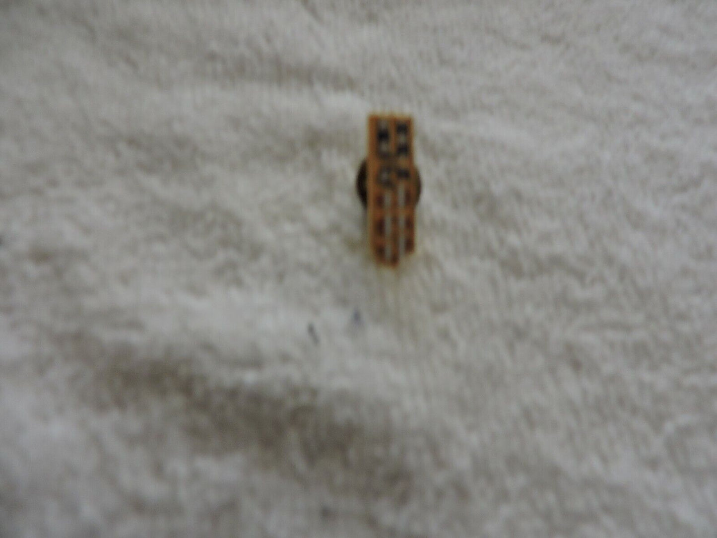 USS SWIMMING RED, WHITE AND BLUE PIN 1  X .25 INCHES
